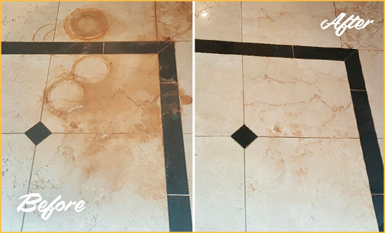 Before and After Picture of a Golden Hard Surface Restoration Service on a Marble Floor to Eliminate Rust Stains